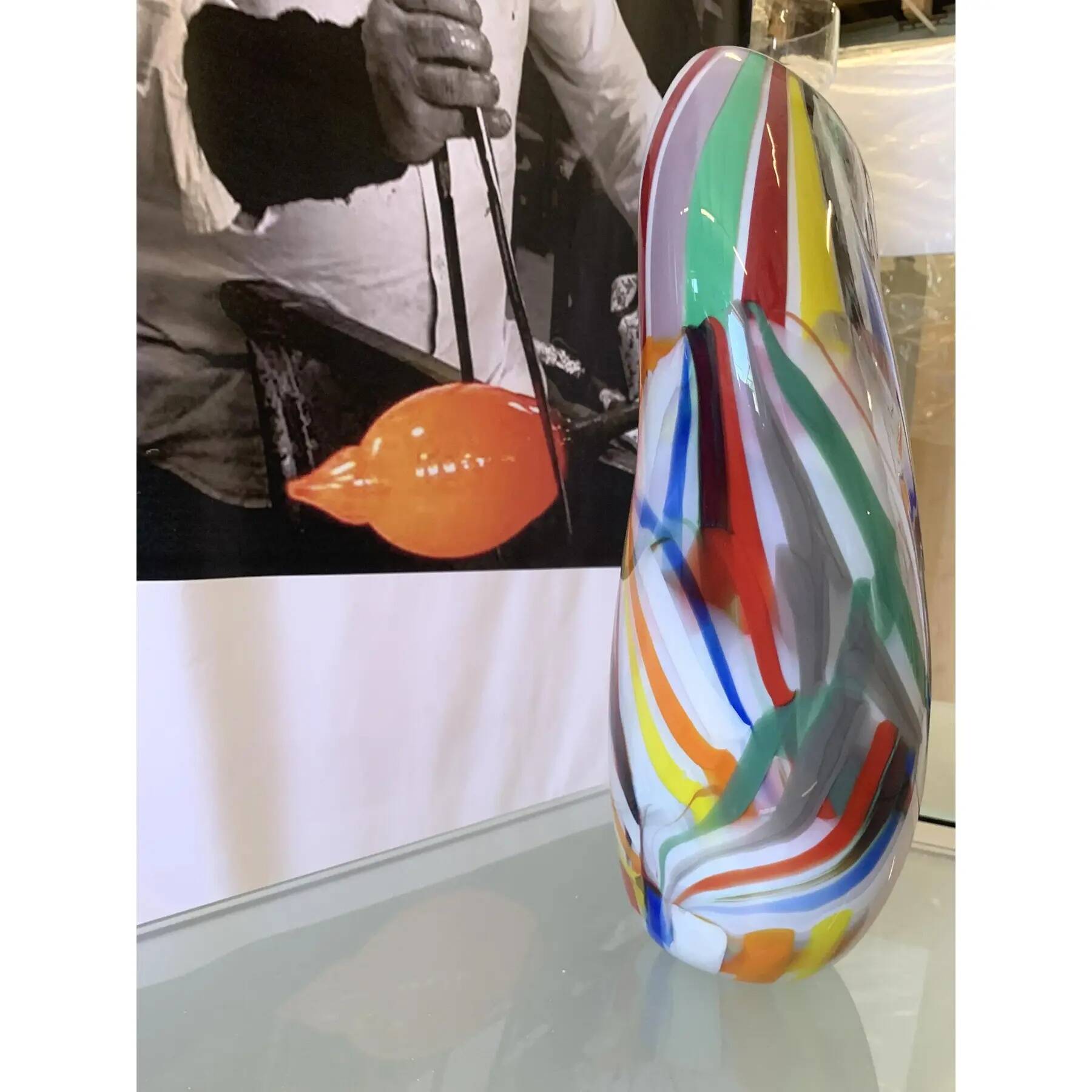 Abstract vase in milky-white Murano-inspired glass with multicoloured reeds.