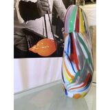 Abstract vase in milky-white Murano-inspired glass with multicoloured reeds.