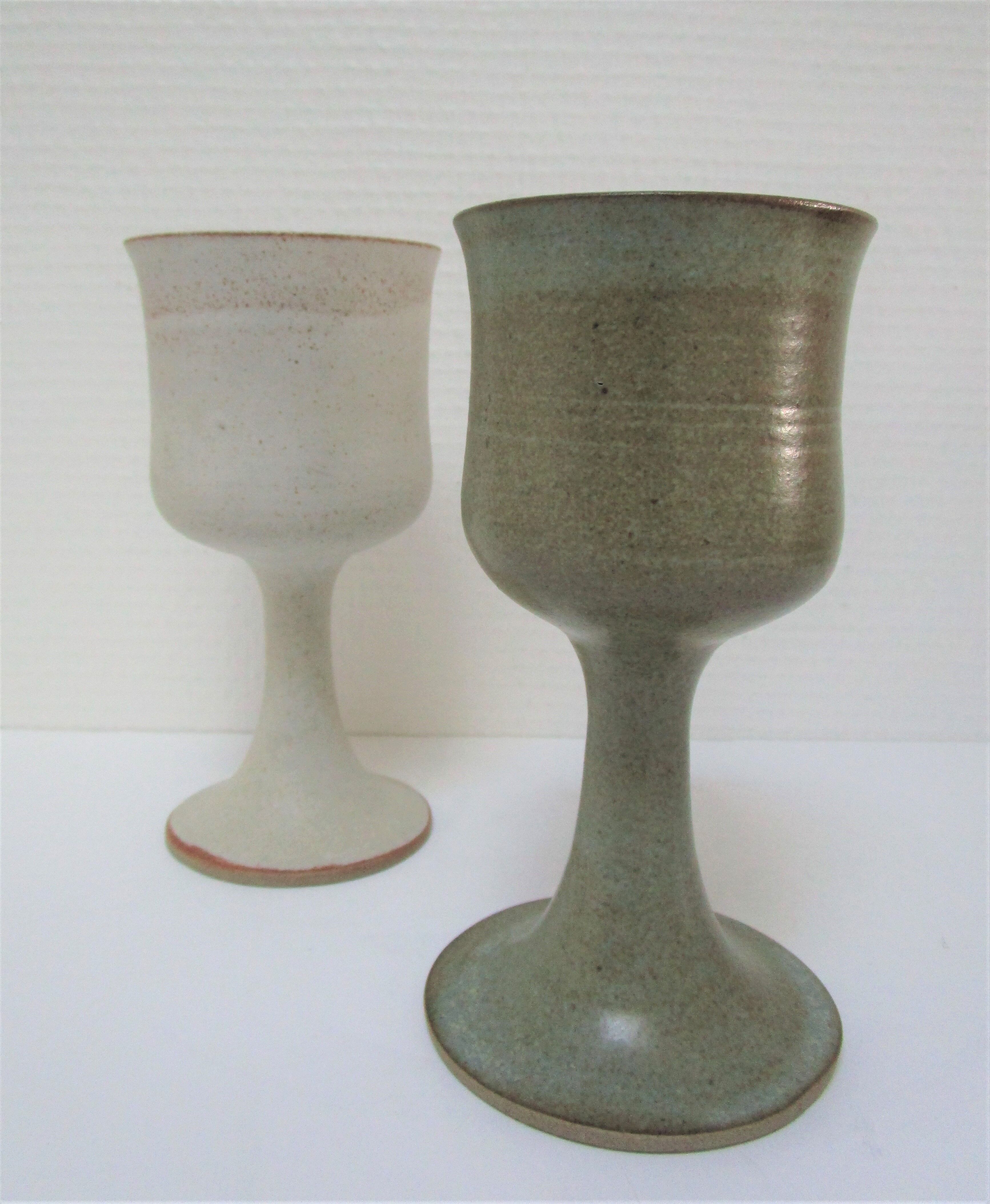 Two enamelled ceramic walking glasses