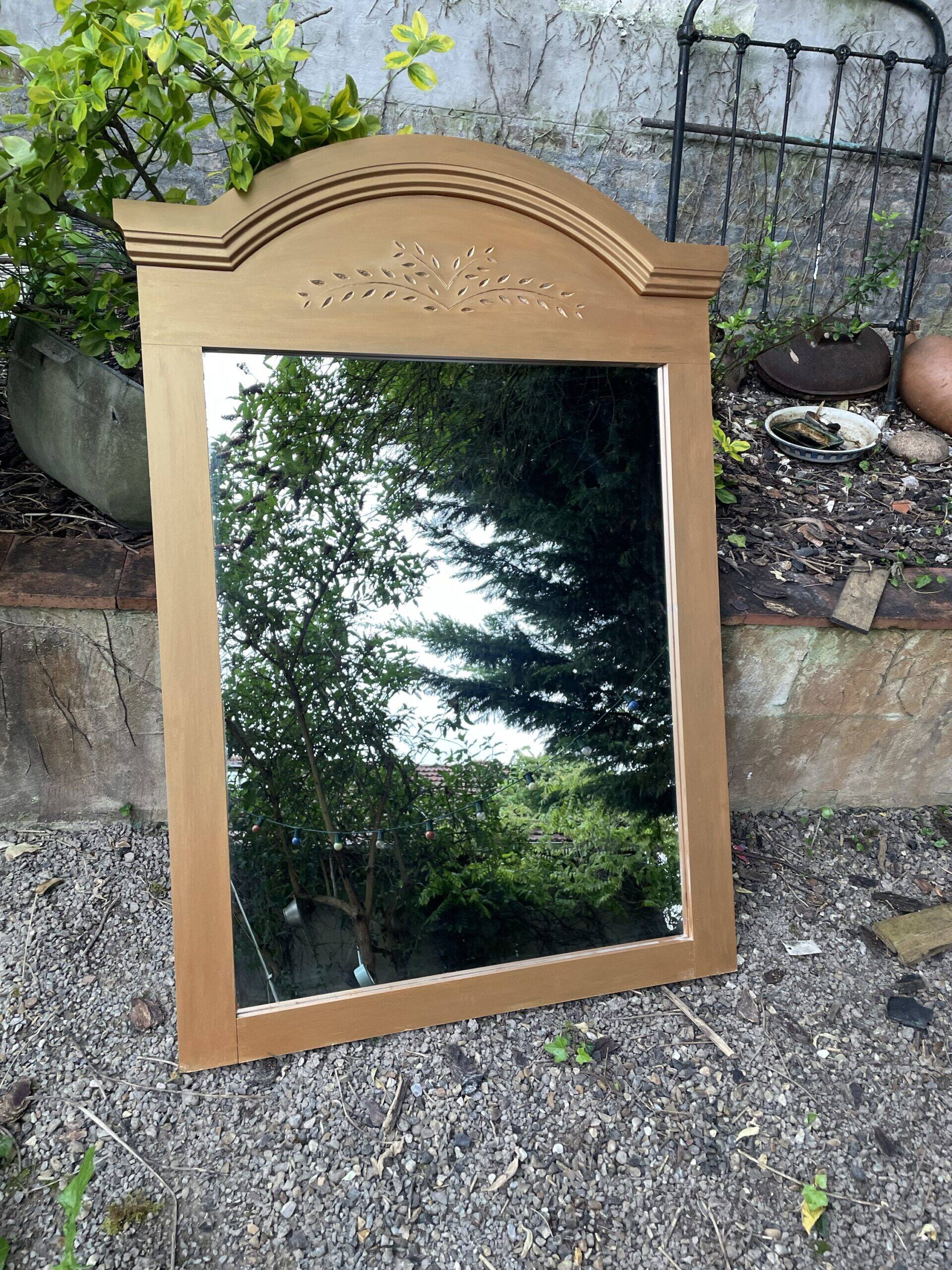 Golden mirror with wheat decoration
