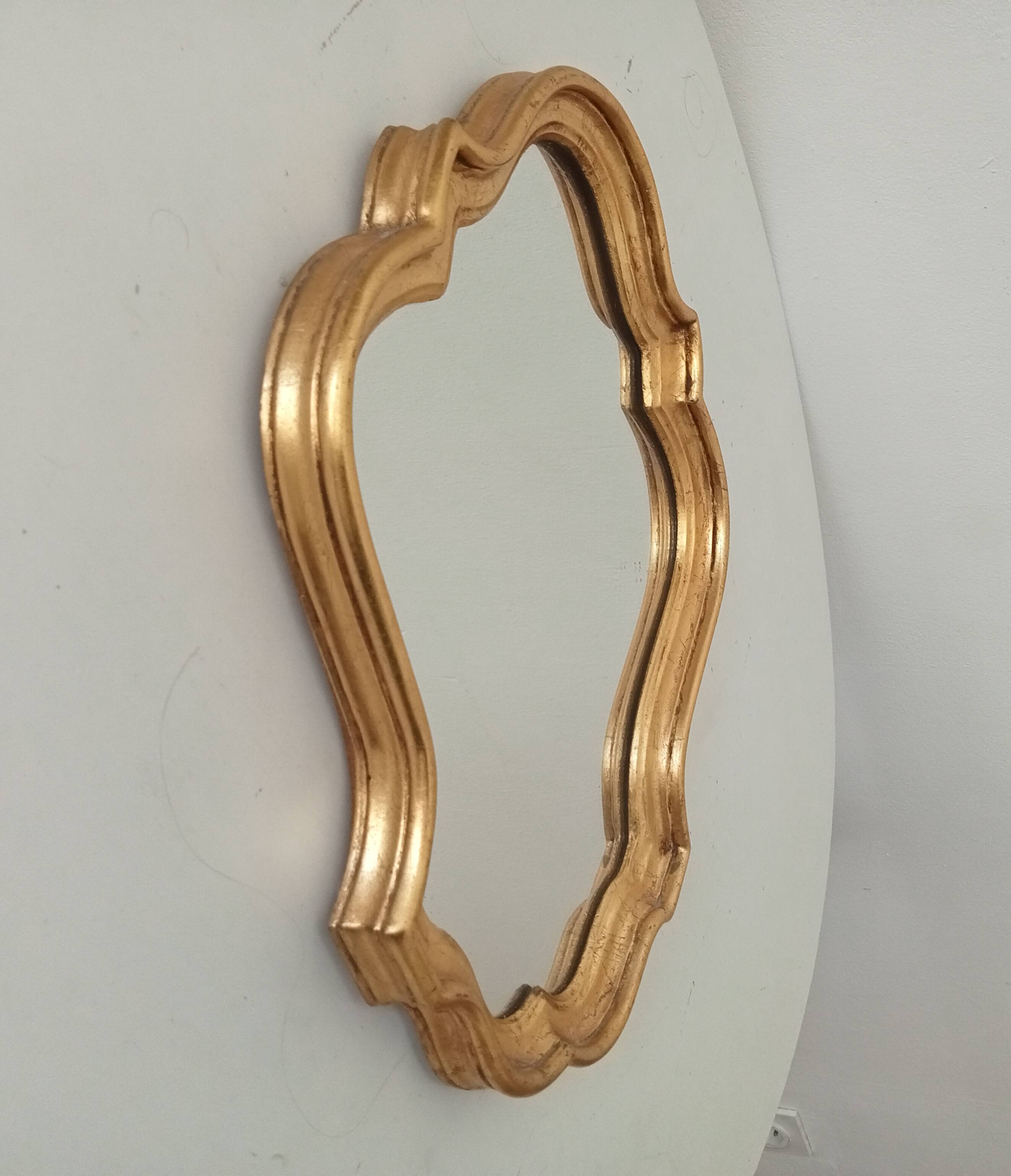 Baroque mirror in gilded wood from the 1960s.