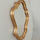 Baroque mirror in gilded wood from the 1960s.