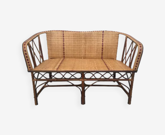 Braided rattan sofa and red edging