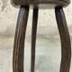 Vintage tripod plant stand with curved legs.