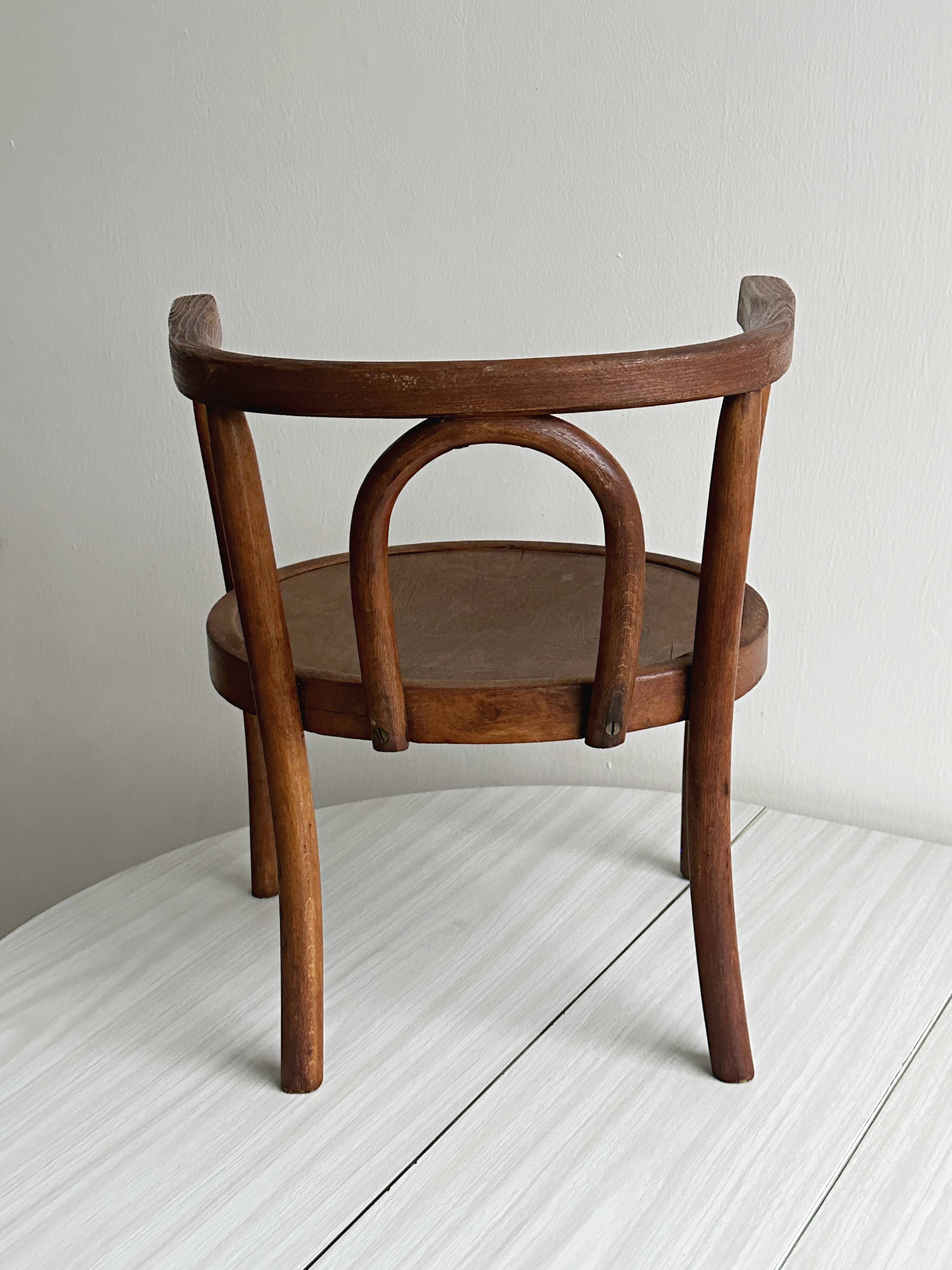 vintage curved wooden children's chair
