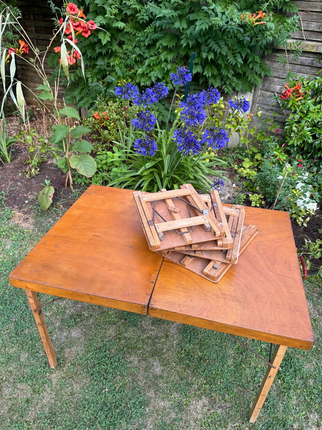 Old suitcase, table and stools, vintage wooden picnic