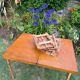 Old suitcase, table and stools, vintage wooden picnic