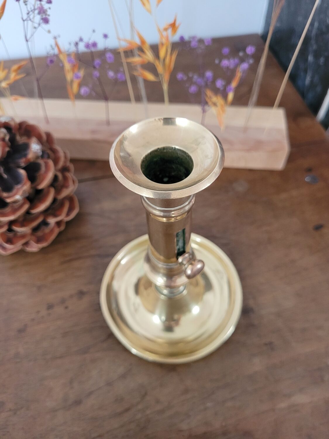 Push candle holder with hollow dish