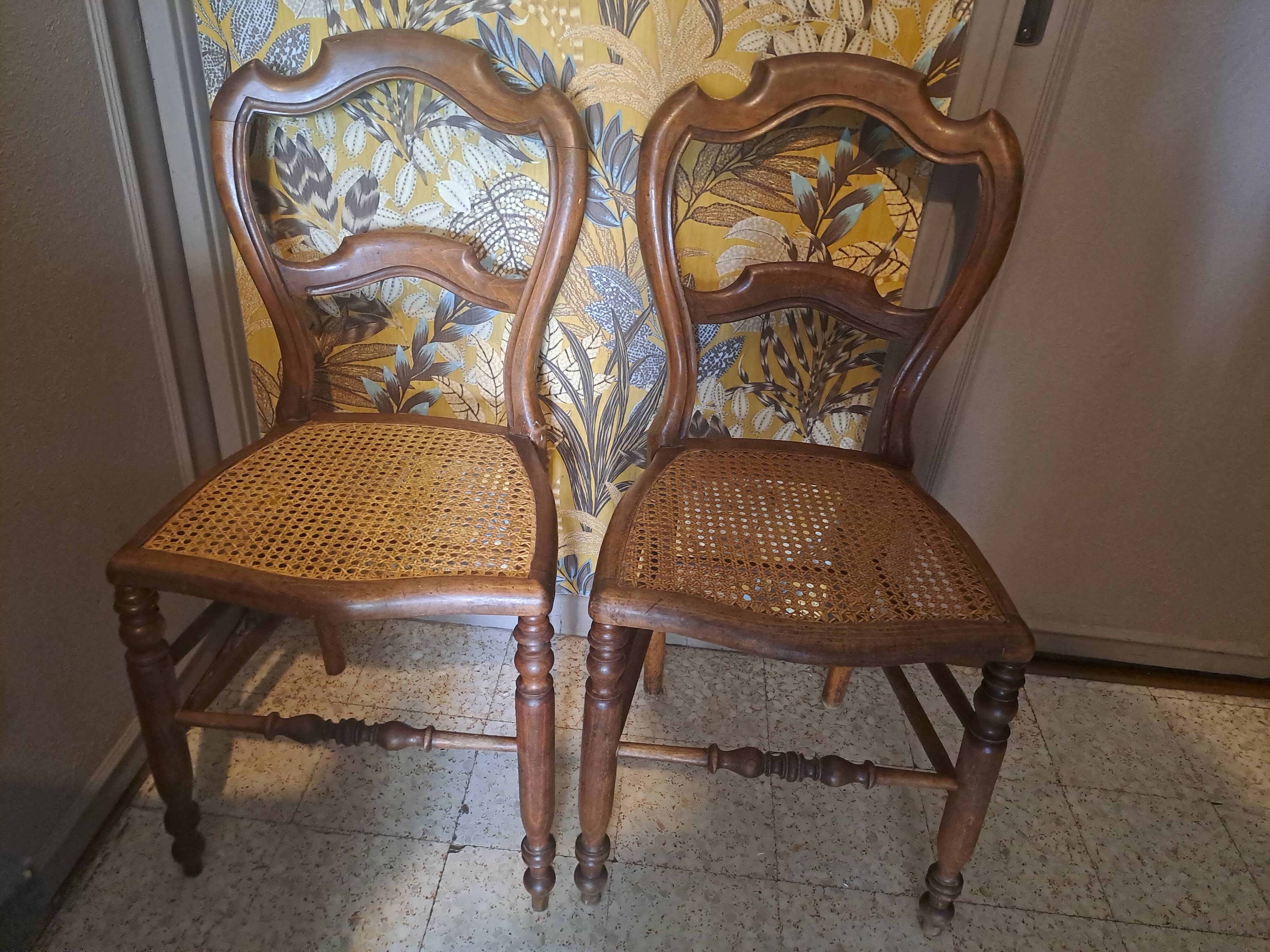 Pair of 1950s light wood bistro chairs with cane seats