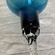 Pair of Murano (or Empoli) glass candlesticks with twisted bases, vintage 1960.