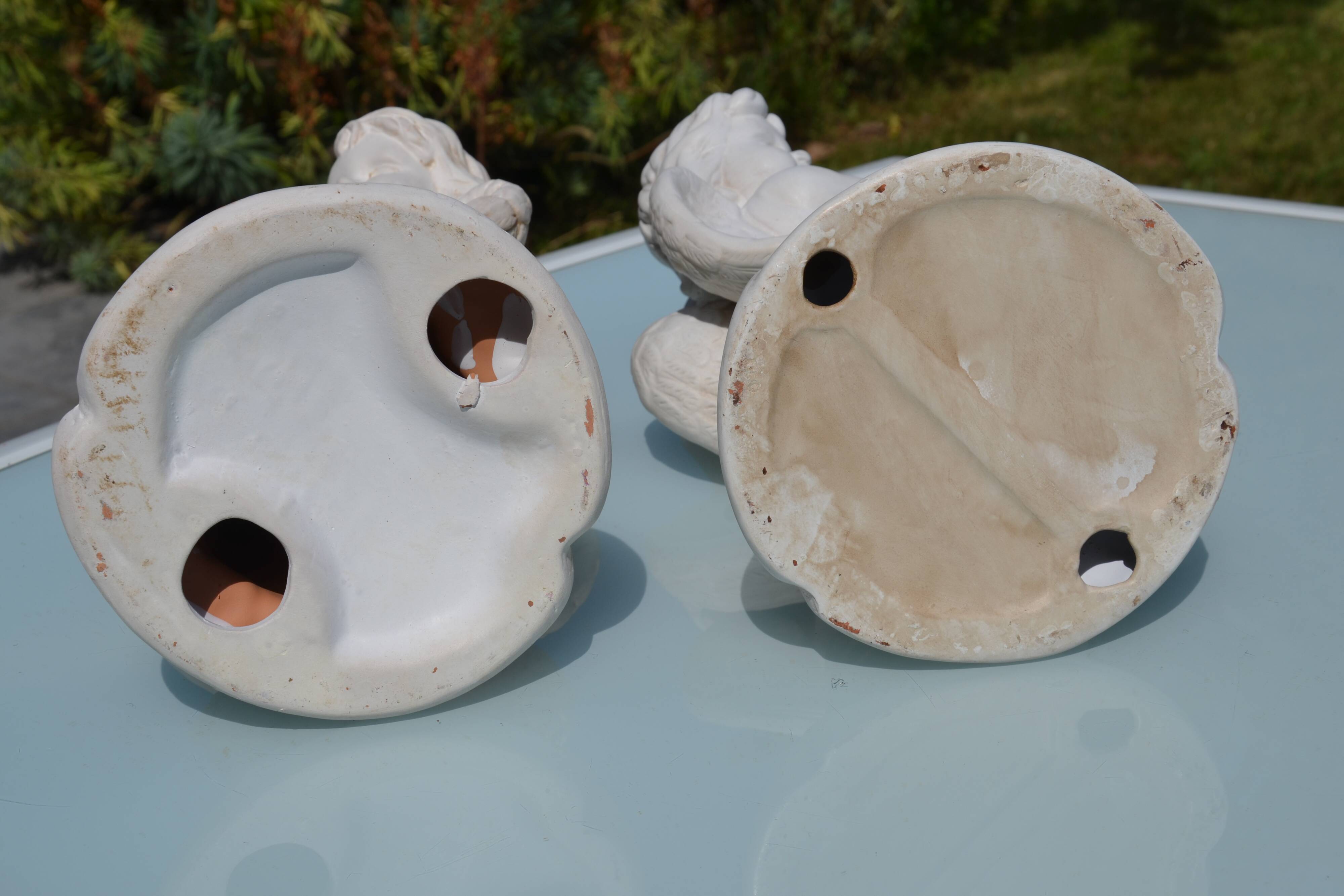 Pair of "cherub" candle holders in plaster