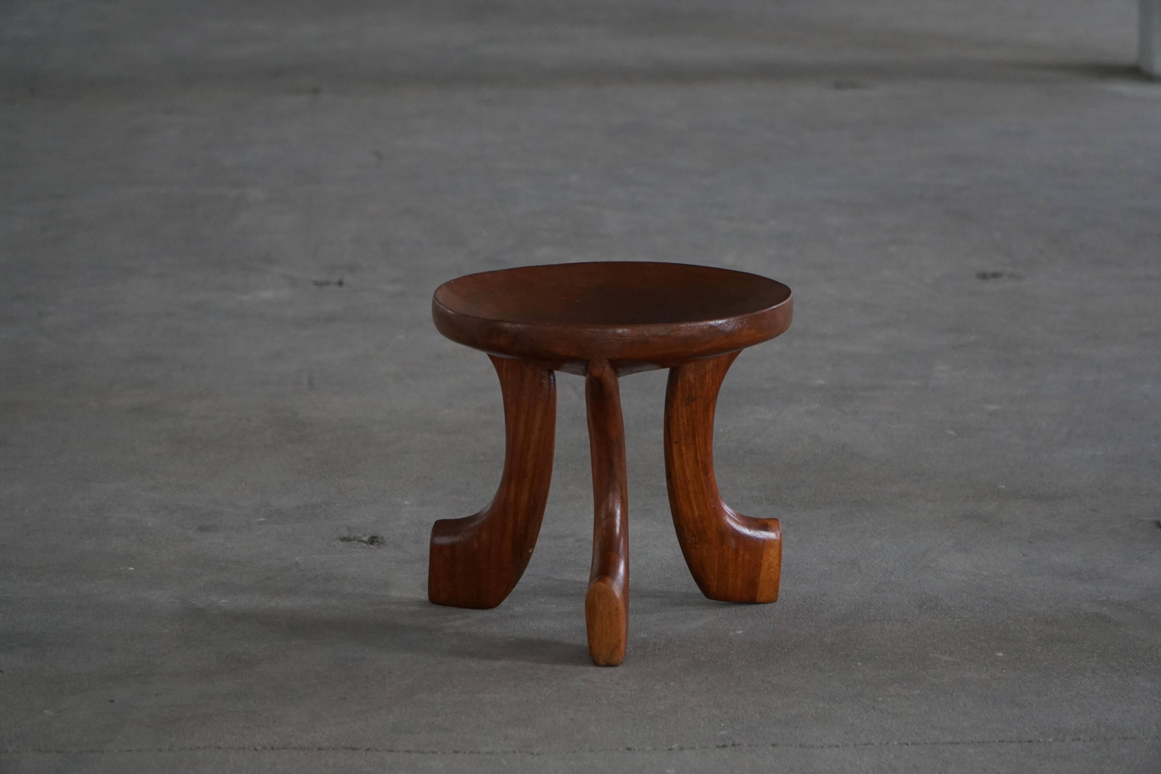 Oromo stool from mid-20th century Africa, hand-carved wood, tribal style.