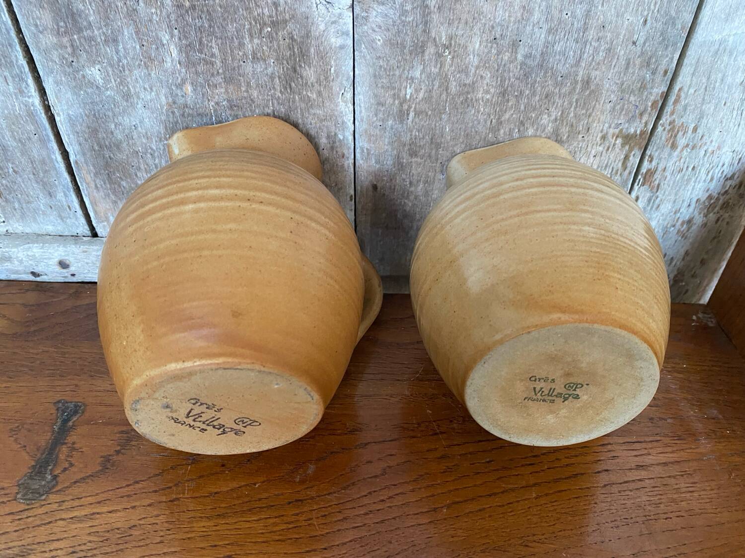 Pair antique cnp village beige & cream stoneware pitchers vintage