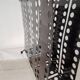 “Santiago” magazine rack in perforated sheet metal Mathieu Mategot 1950s