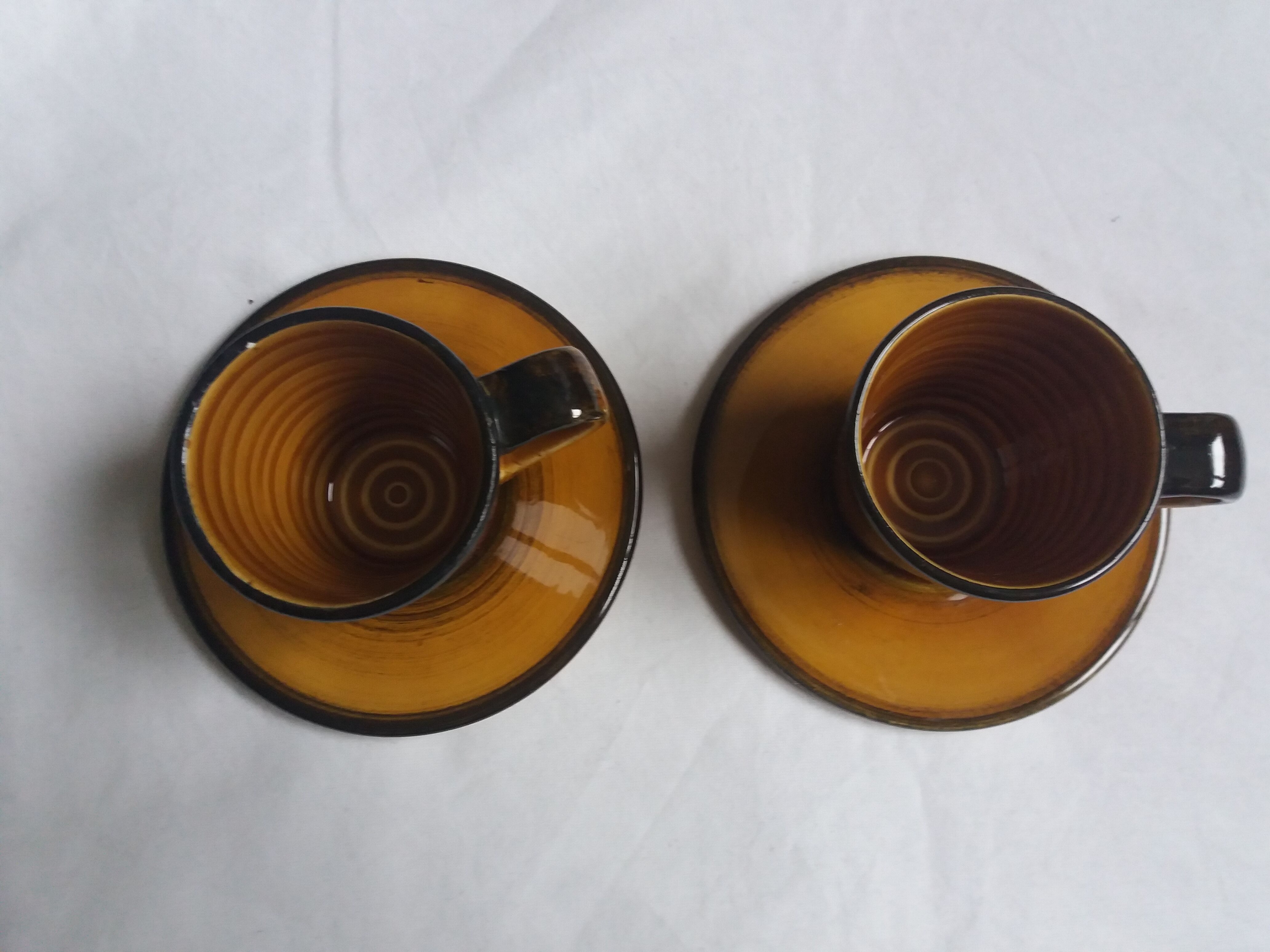 2 Longchamp ceramic coffee cups and saucers