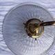 Holophane glass and brass wall light