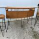 Vintage 1950s bar counter with its two rattan and metal stools.