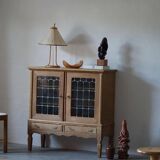 20th-century mid-century solid oak sideboard with glass front, by a Danish cabinetmaker.