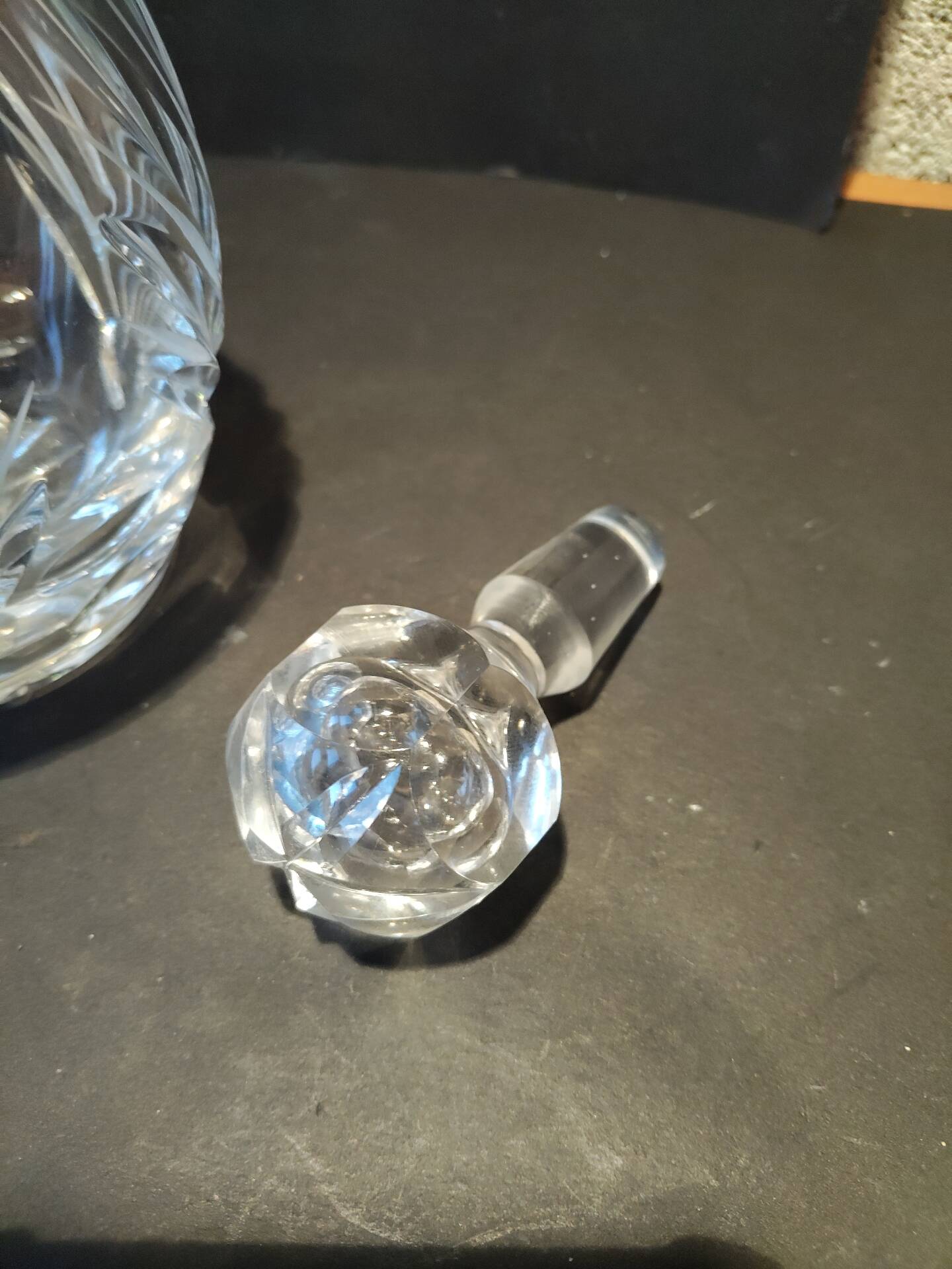 Vintage cut crystal carafe with floral stopper.