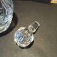 Vintage cut crystal carafe with floral stopper.