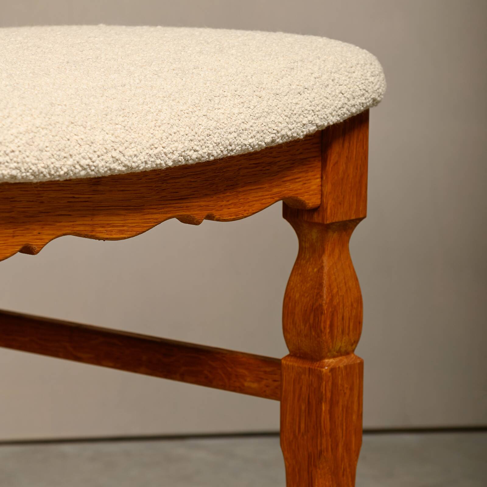 Henning Kjærnulf dining chairs set in Oak and Off White Bouclé, Denmark, 1960s