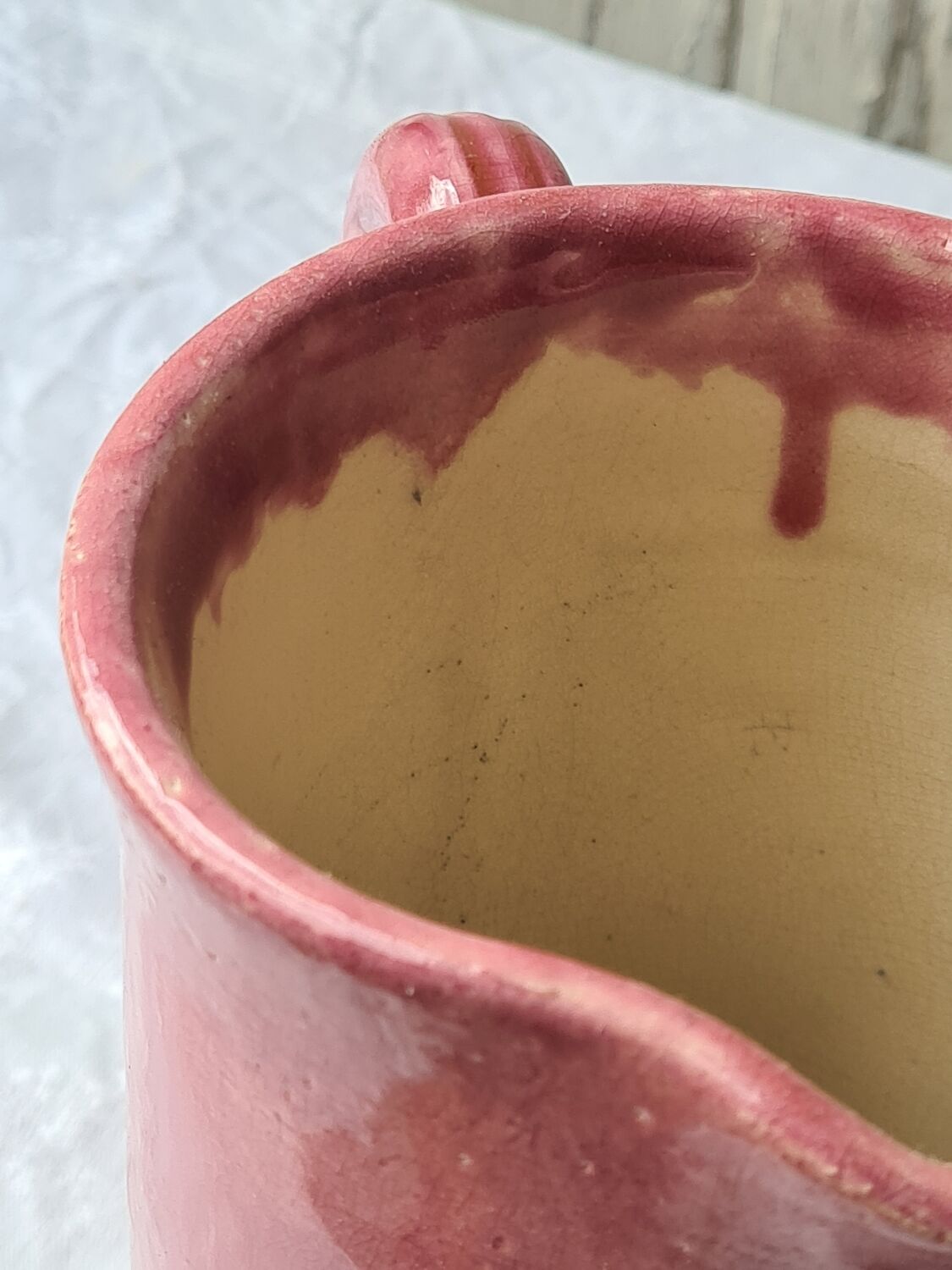 Glazed terracotta pitcher with mimosa decoration