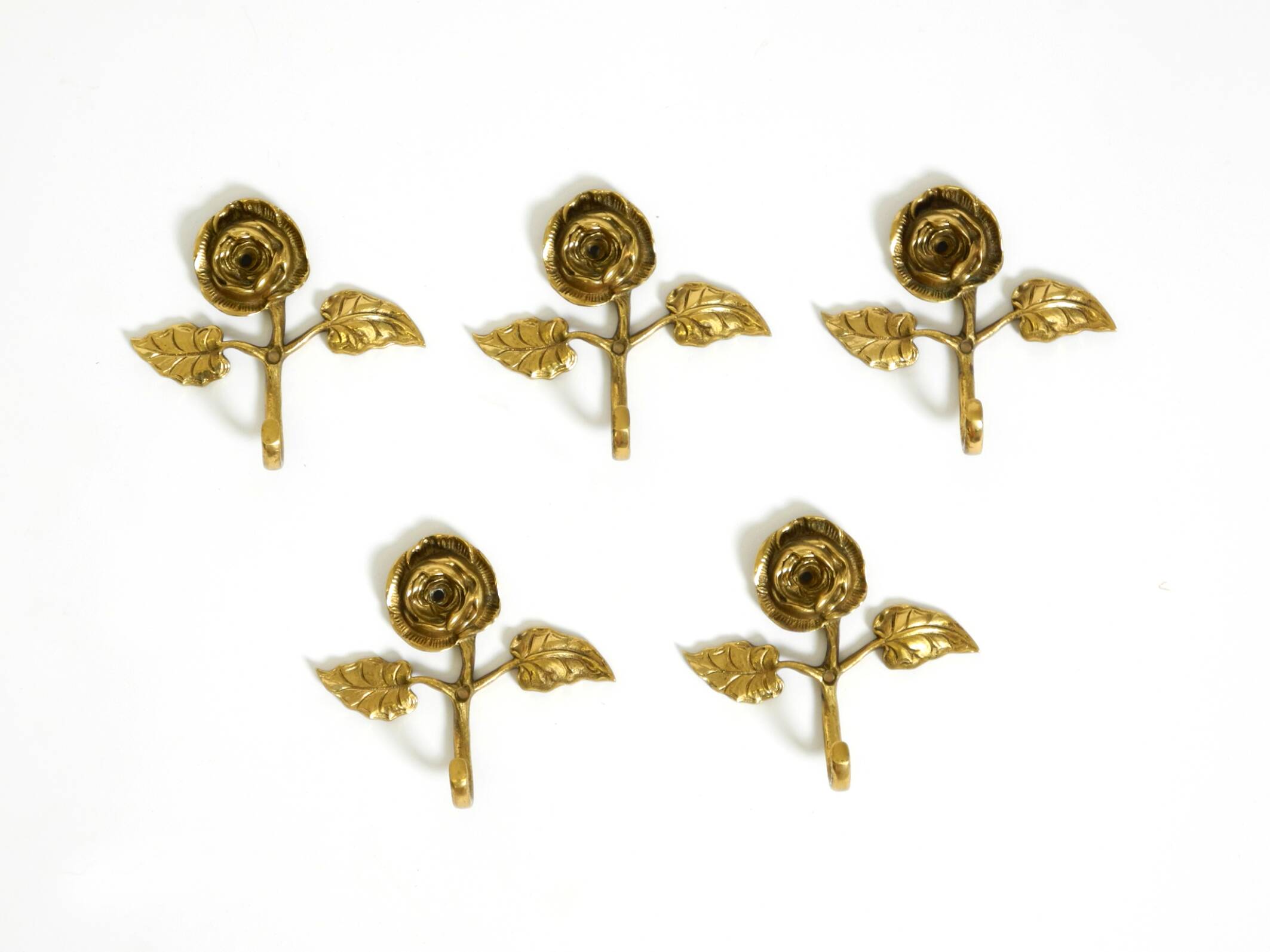Set of five beautiful, solid mid-century brass rose wall coat hooks
