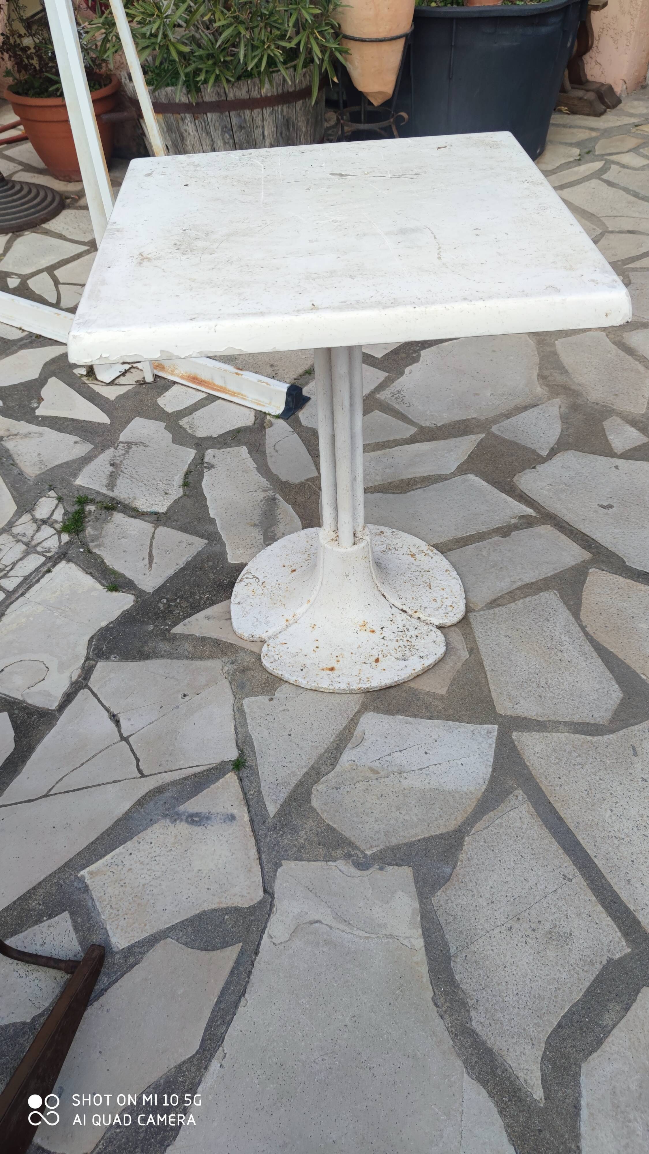 Garden or bistro table with steel and fiberglass base and top, circa 1970