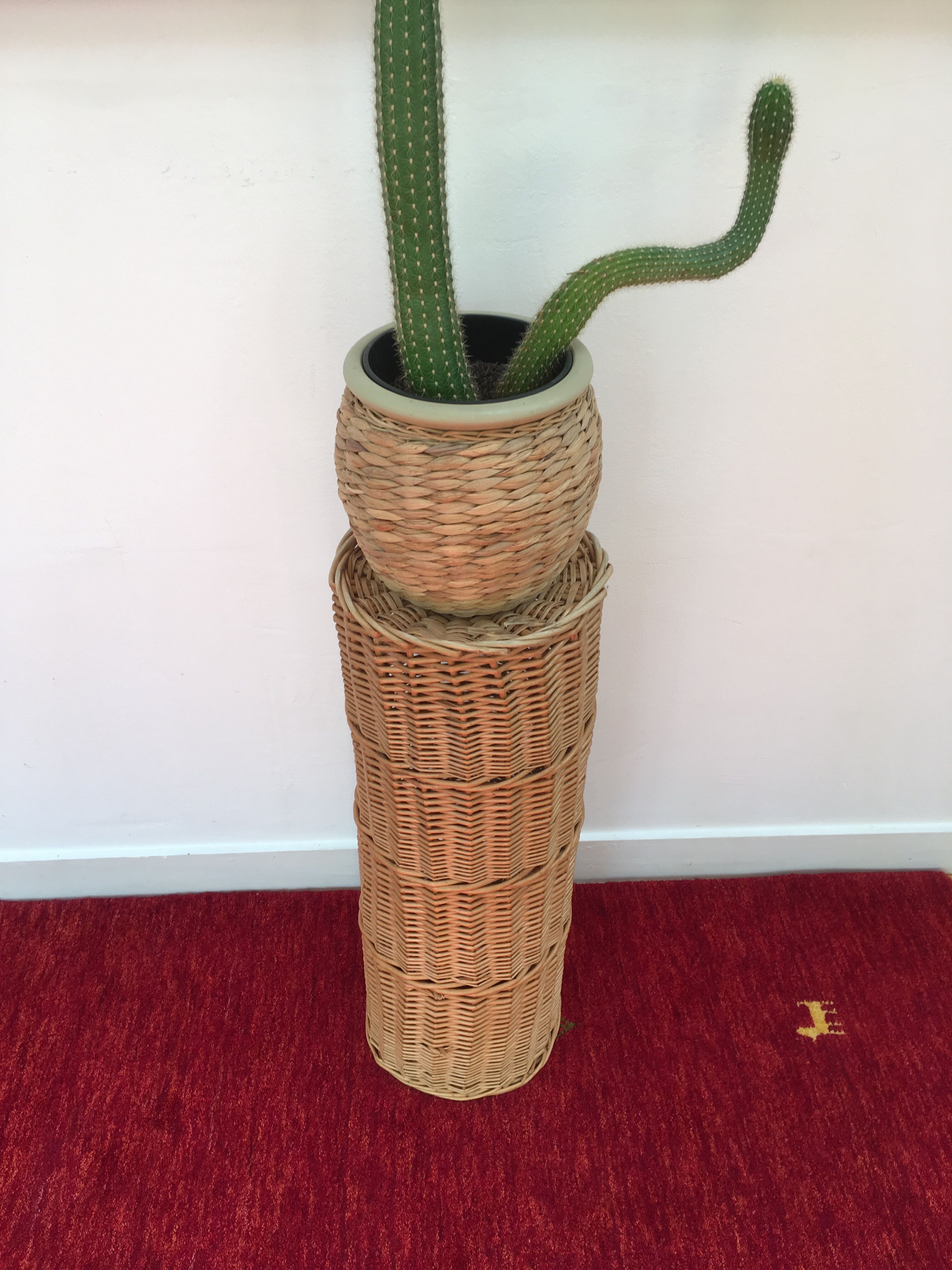 Vintage umbrella holder in wicker rattan
