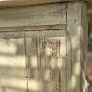 Curved antique commode in pistachio green patina.