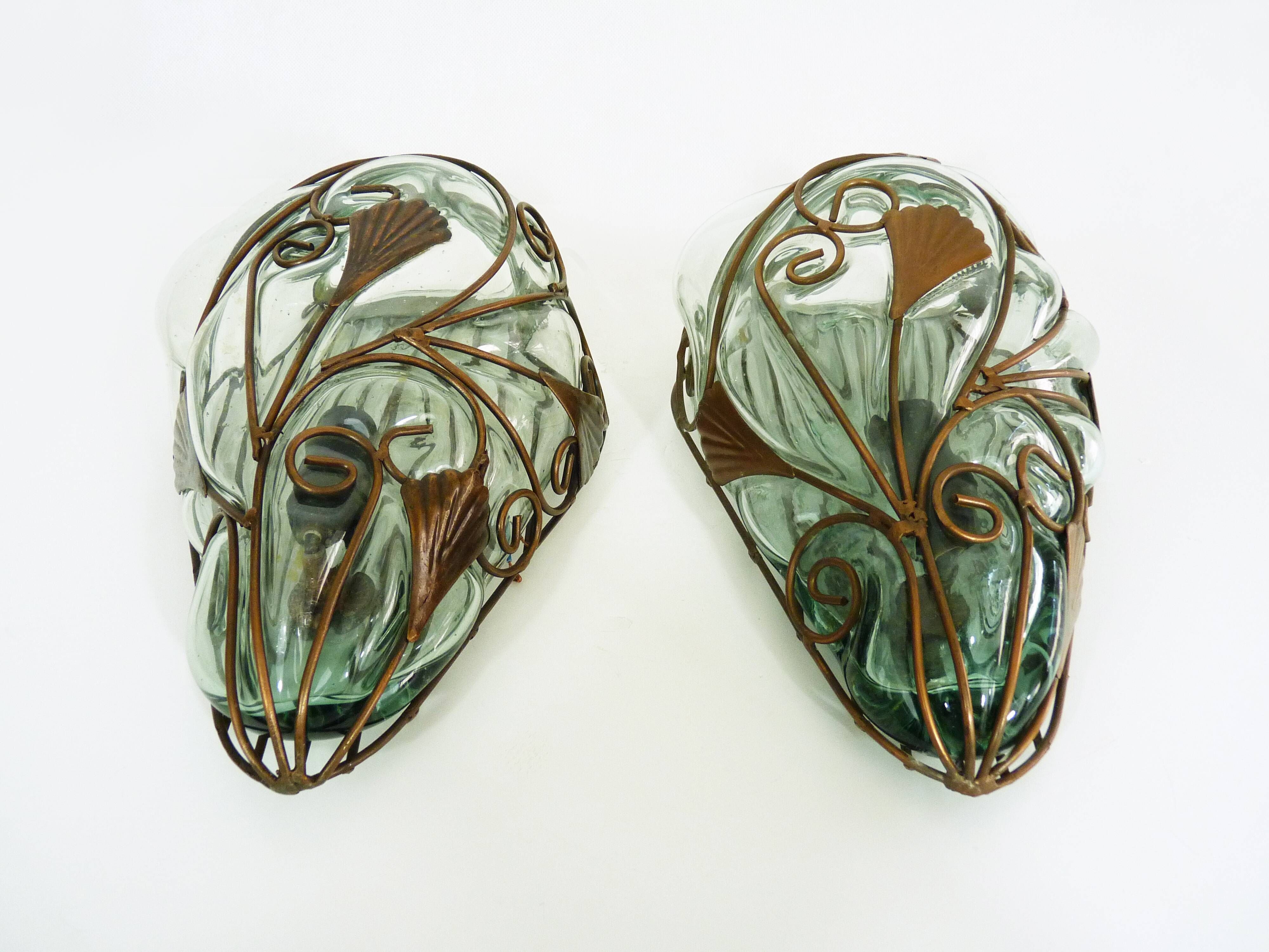 Pair of wall light cage in blown glass green color and wrought iron. Murano style. Year 80