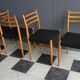 Set of 4 dining chairs in wood and black fabric 1960s