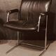 Pair of black leather Scandinavian armchairs