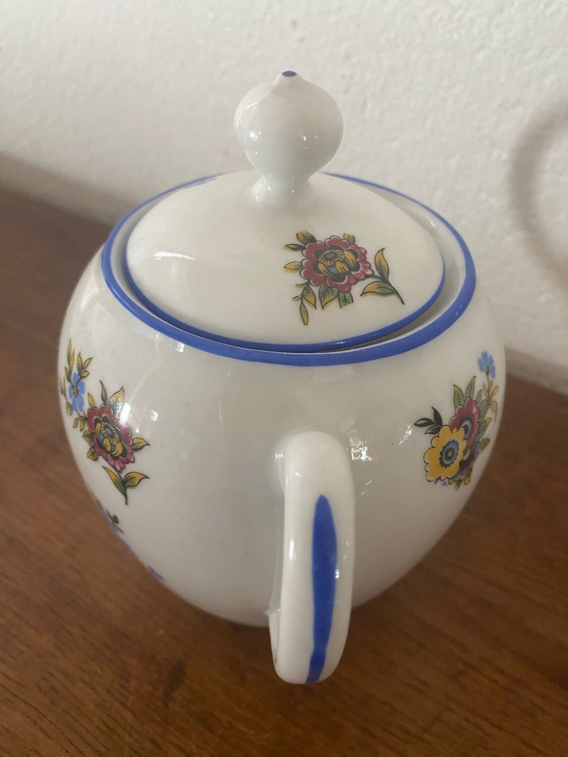 Large sugar bowl with floral porcelain.