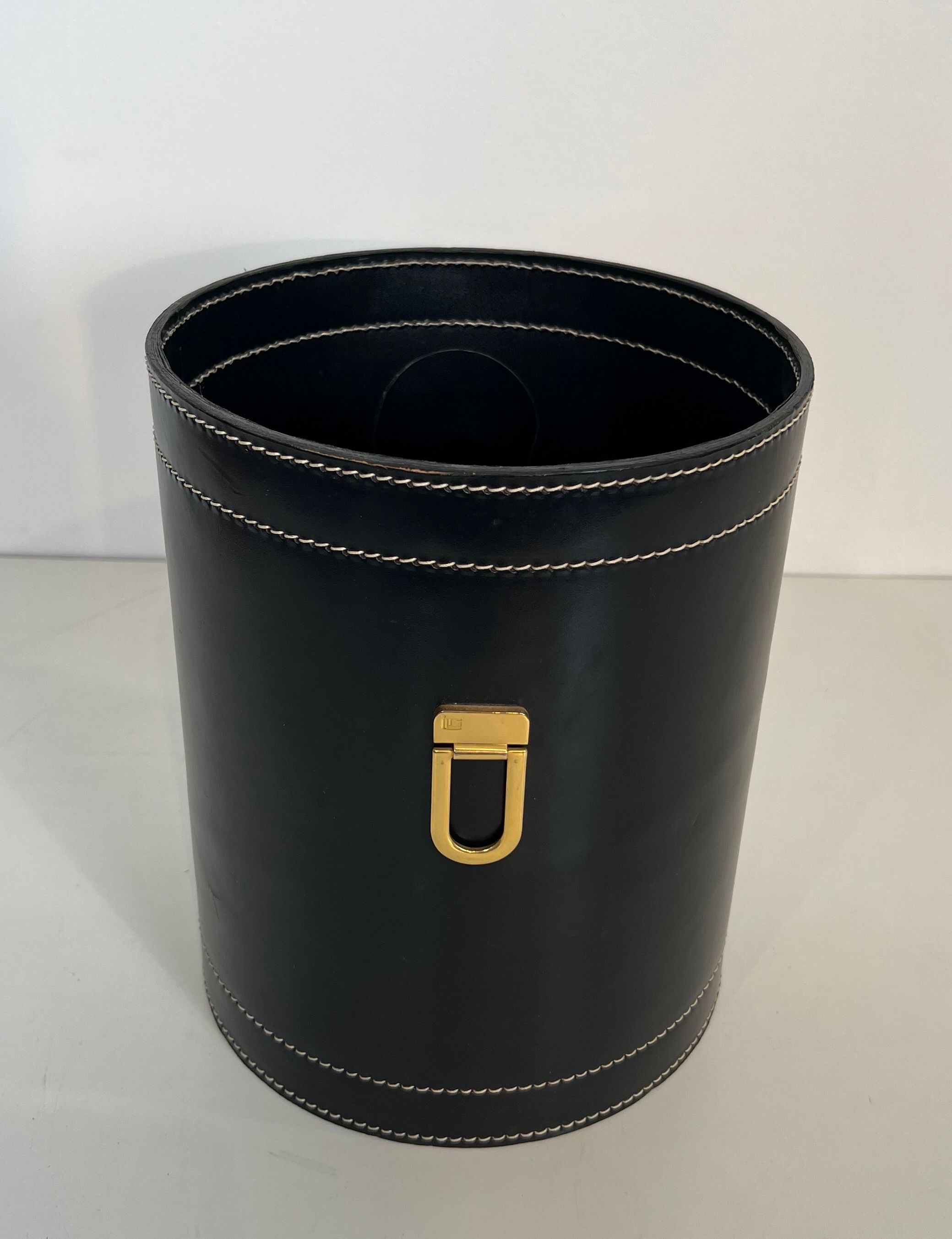 Black leather and brass desk basket