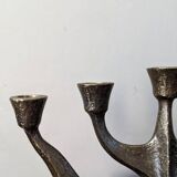 Vintage bronze candlestick chandelier in contemporary Scandinavian design.