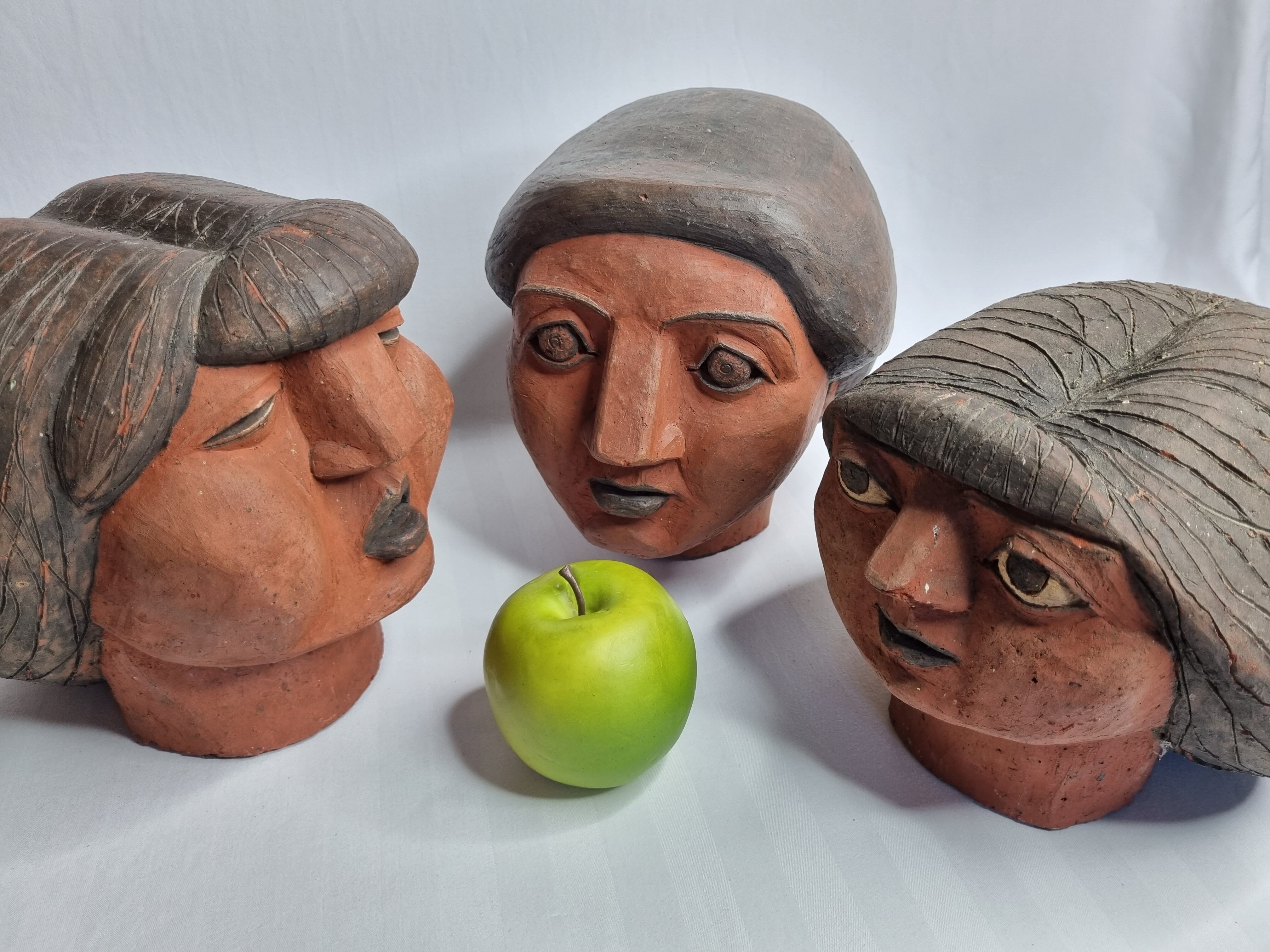 Set of 3 decorative women's heads in red terracotta