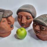 Set of 3 decorative women's heads in red terracotta