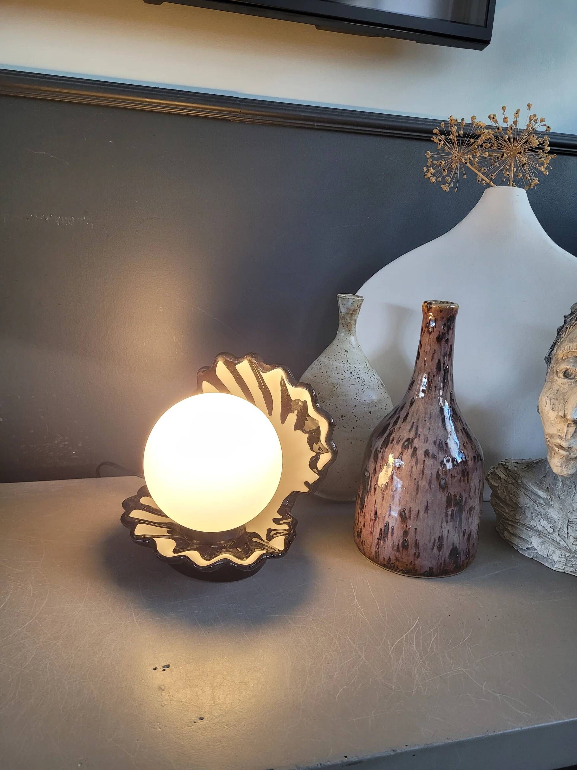 Vintage shell lamp in black porcelain with opaline globe.