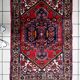 1950s handmade wool medallion rug, red and navy, 96 × 144 cm - 1C1290