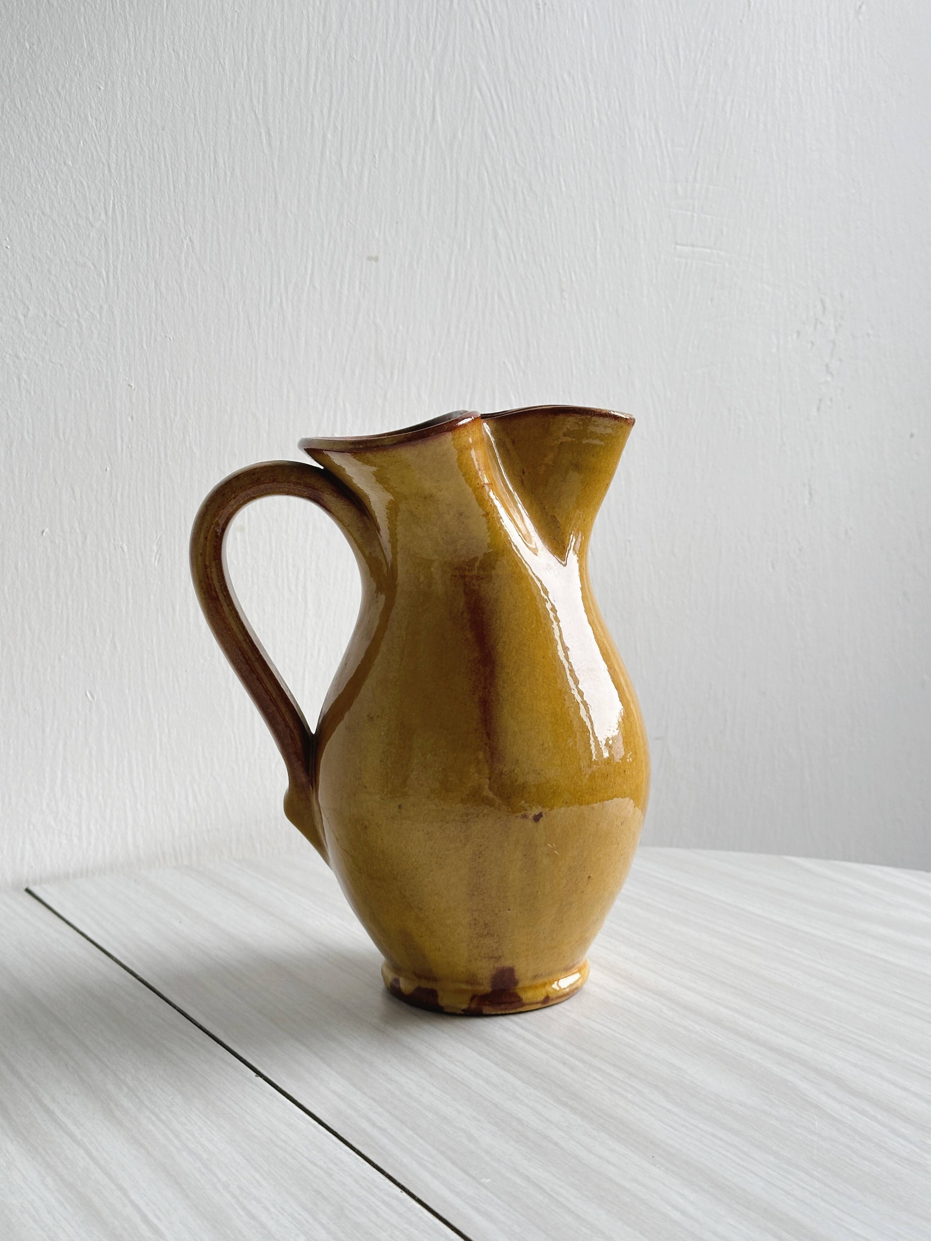 Vintage enameled ceramic pitcher - Retro mustard yellow jar.