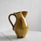 Vintage enameled ceramic pitcher - Retro mustard yellow jar.