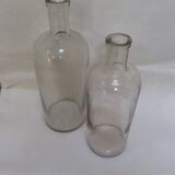 Pair of former pharmaceutical glass bottles