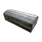Old bulging wooden travel trunk