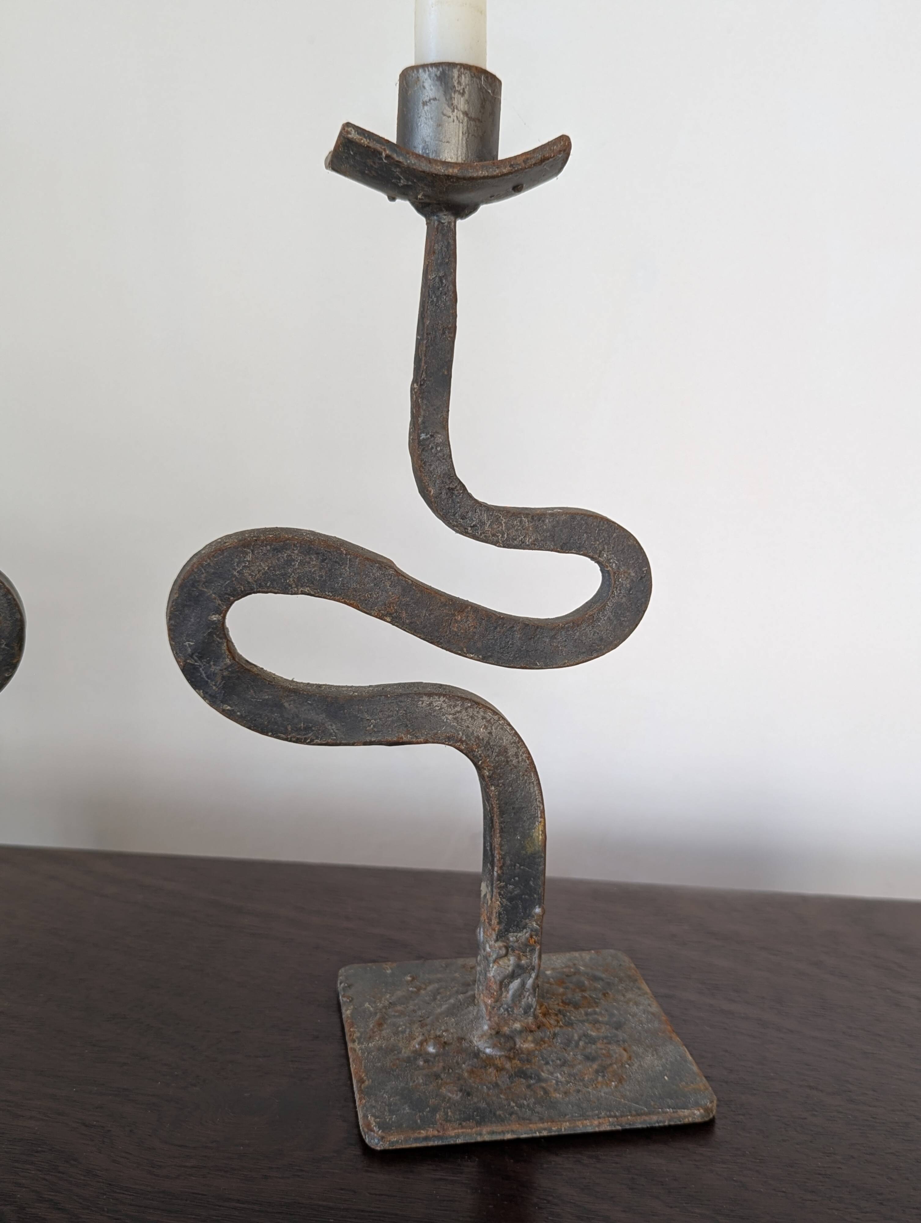 Pair of wrought iron candlesticks