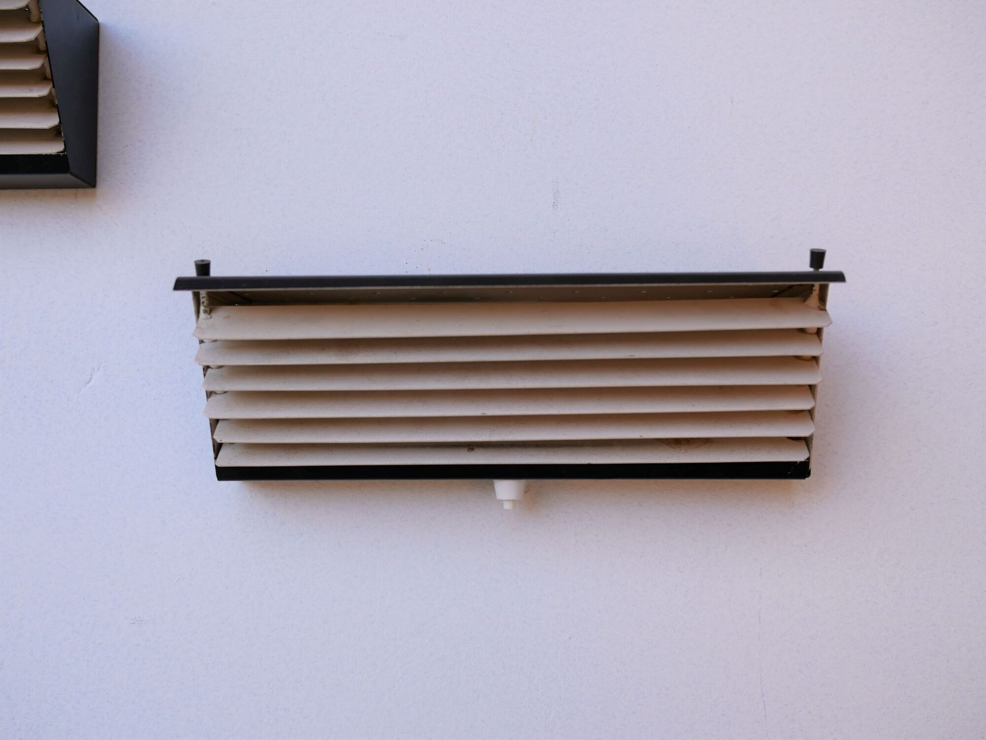 Pair of modernist metal wall light model 212, by Jacques Biny for Luminalite