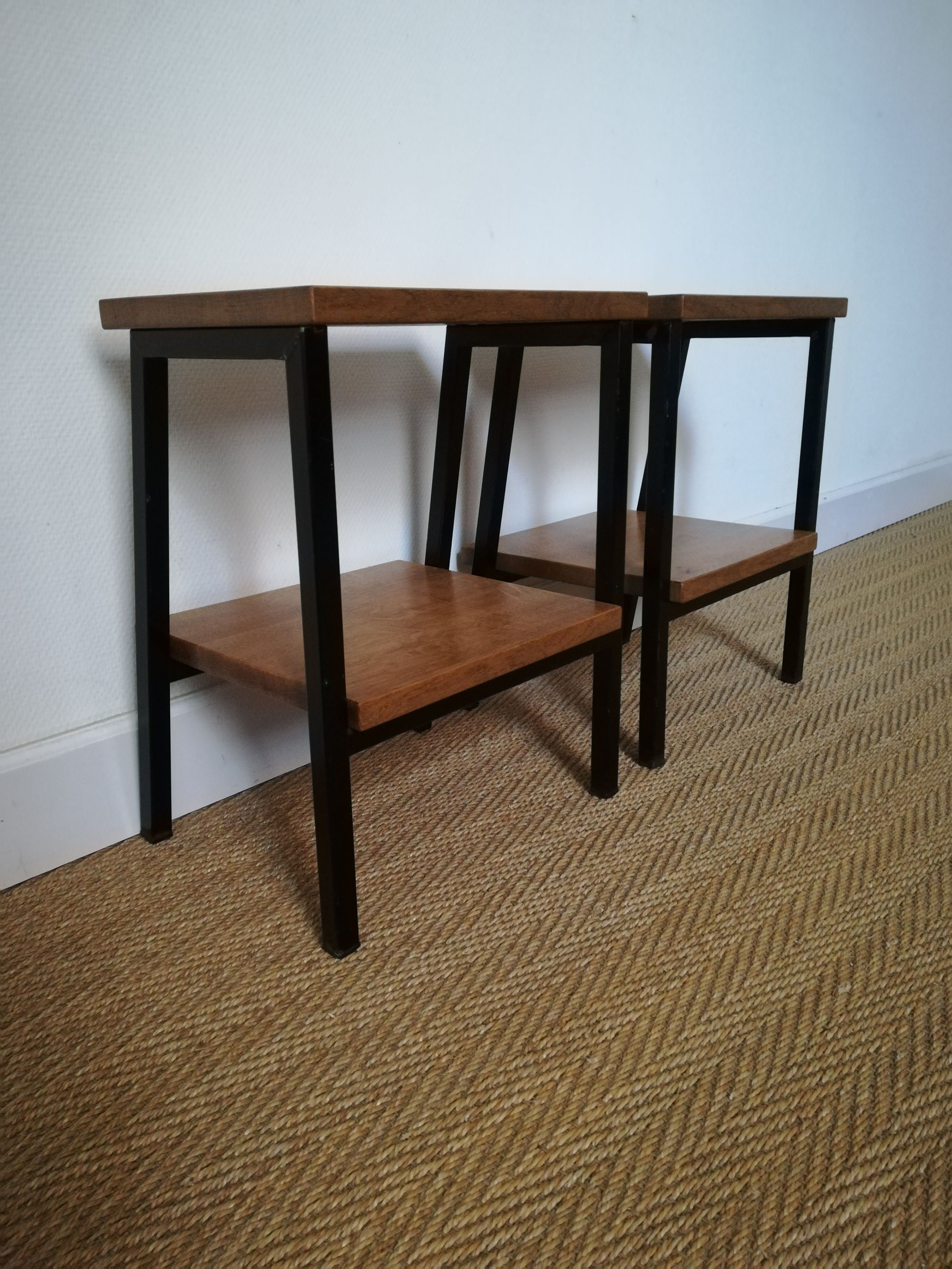 A pair of bedside tables