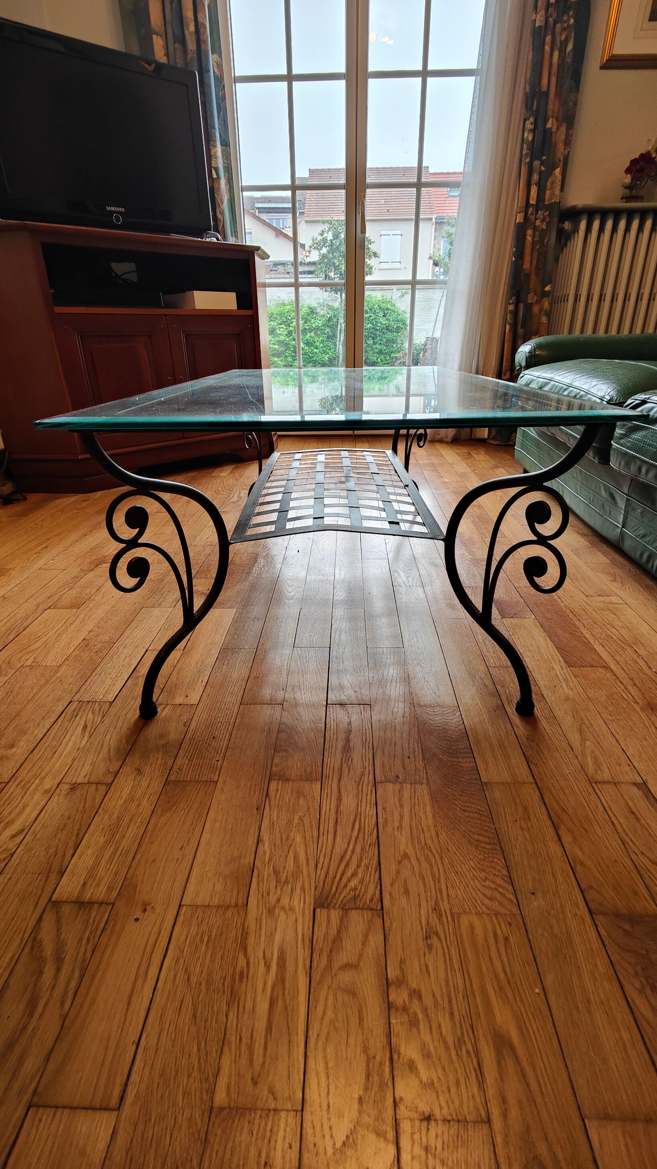 Black wrought iron coffee table and Roche Bobois glass top