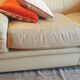 Two-seater convertible sofa bed in off-white leather by Ligne Roset.