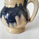 handcrafted ceramic jug with navy blue drip glaze.